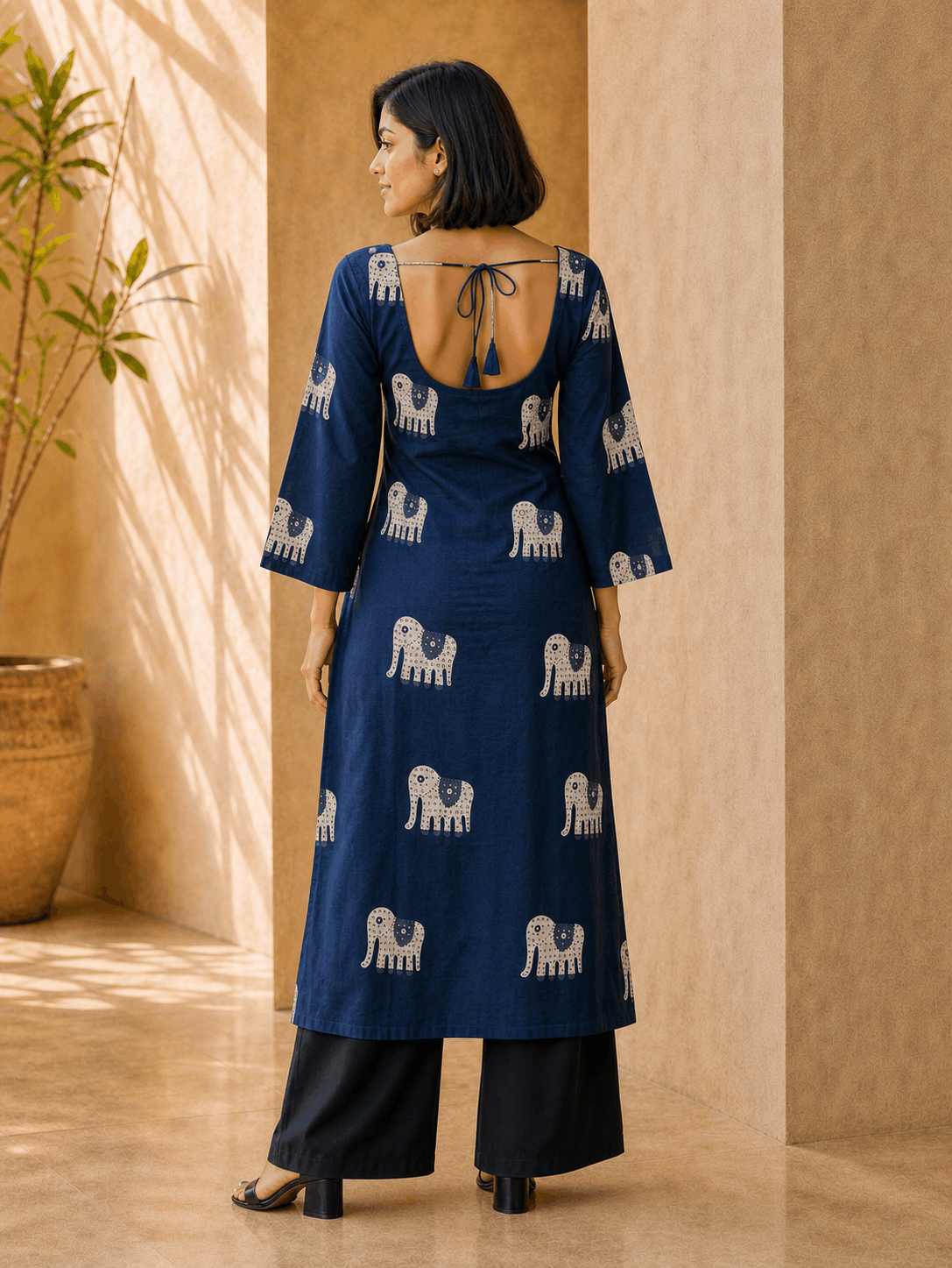 Back view of Neelam indigo Gajraj print long kurti showing the deep open back